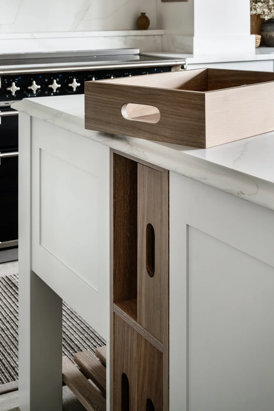 Wooden details of bespoke cabinetry of a kitchen island