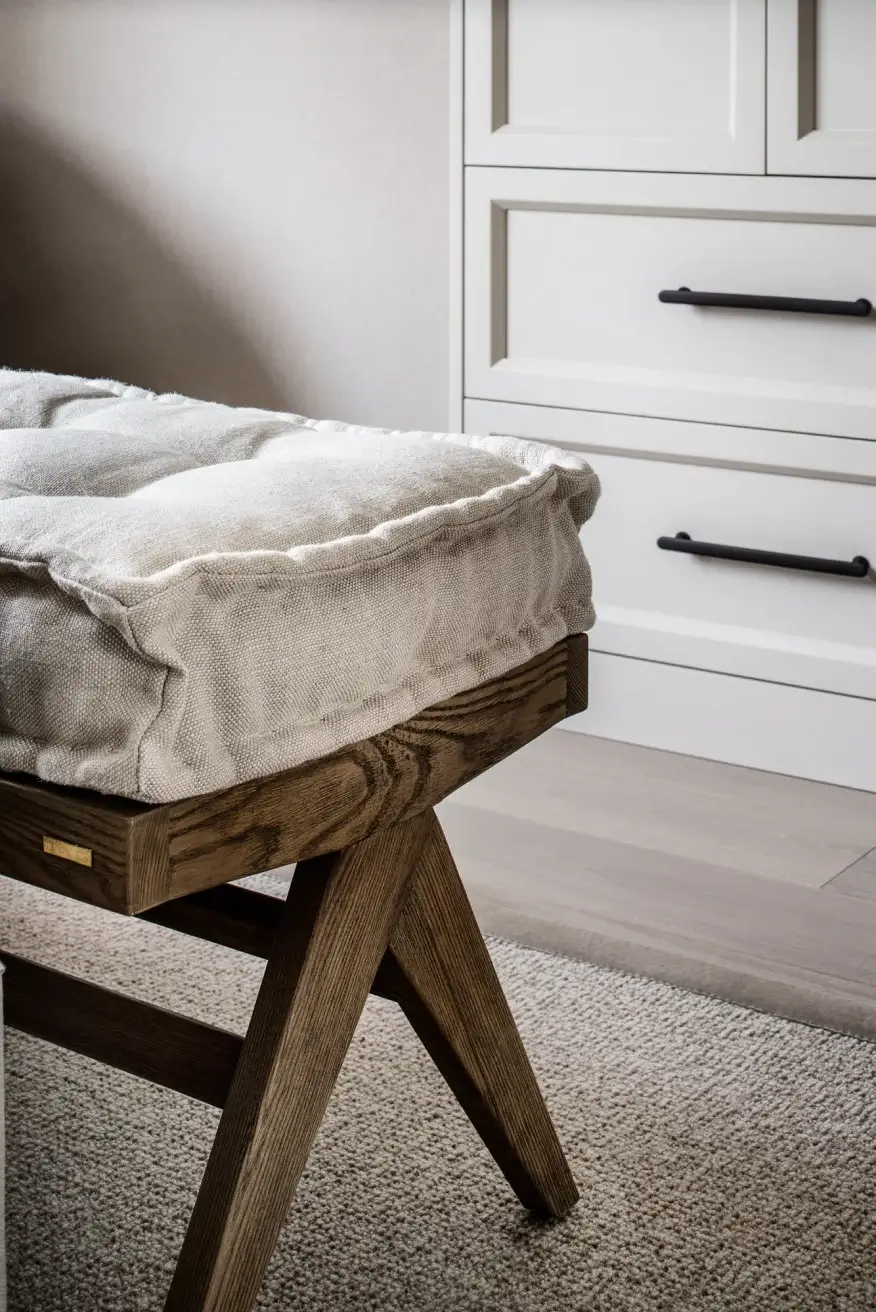 Bespoke joinery bench with white wardrobe behind