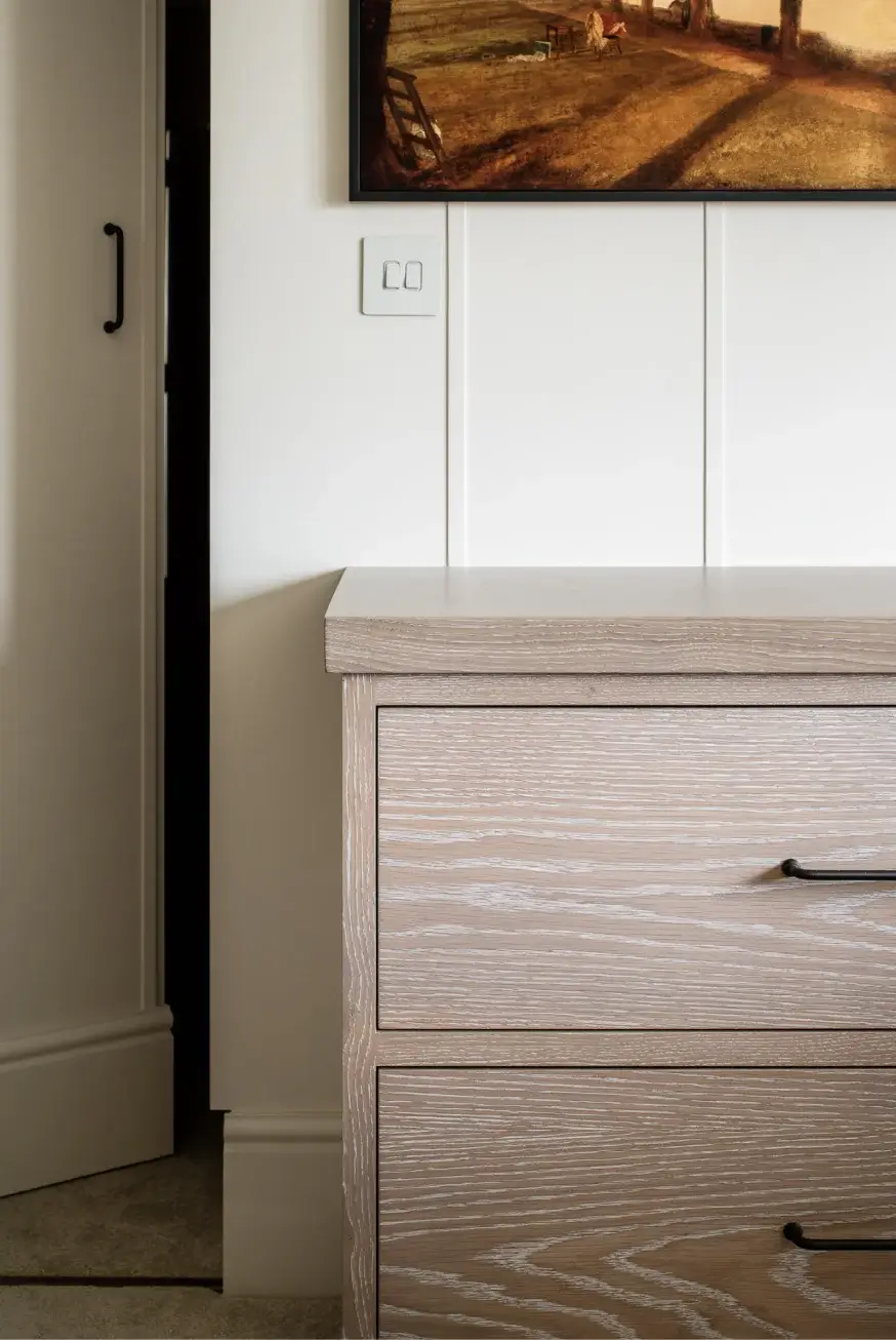 bespoke drawers with wall cladding behind