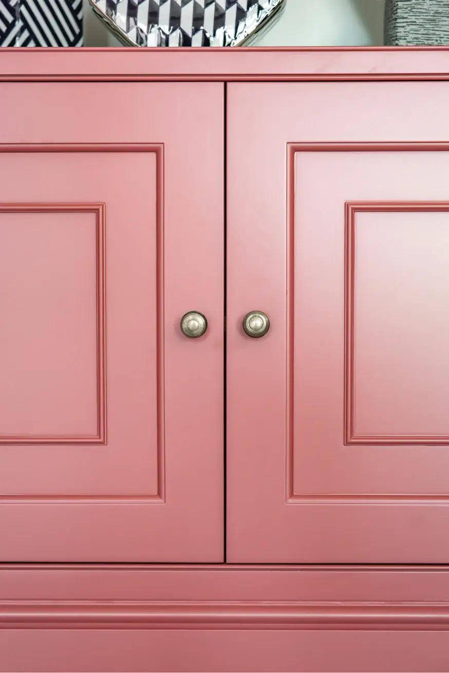 Close up detail of bespoke cabinetry in pink