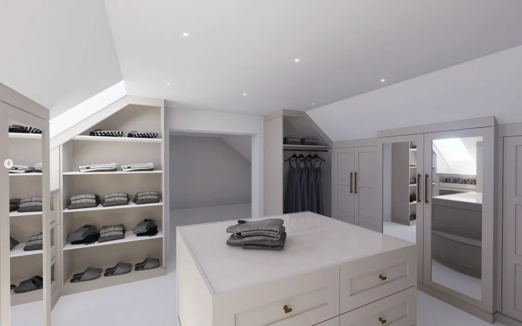 Bright, organized walk-in closet with central island, open shelves of folded clothes, hanging dresses, and mirrored cabinets.
