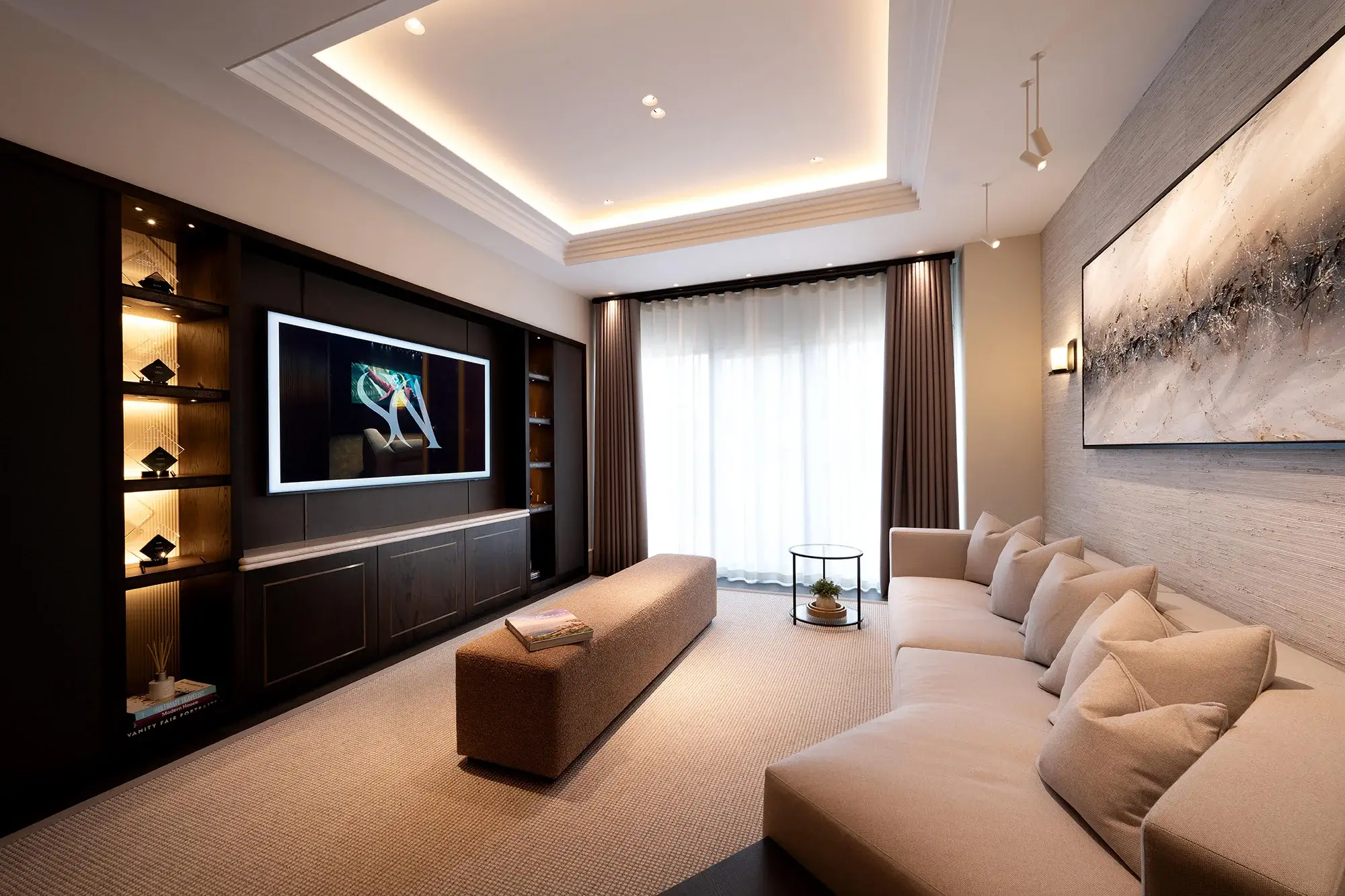 Lounge with large cream sofa and full length media wall