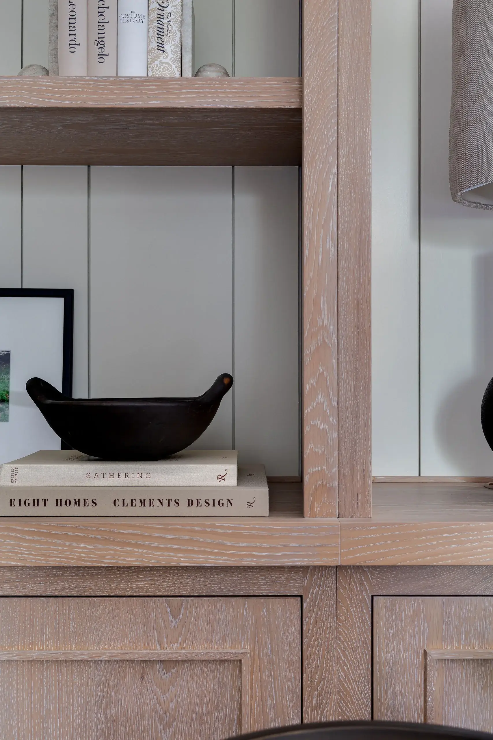 Detailed view of limed oak joinery with panelled back, showing fine grain, soft edges, and refined craftsmanship.